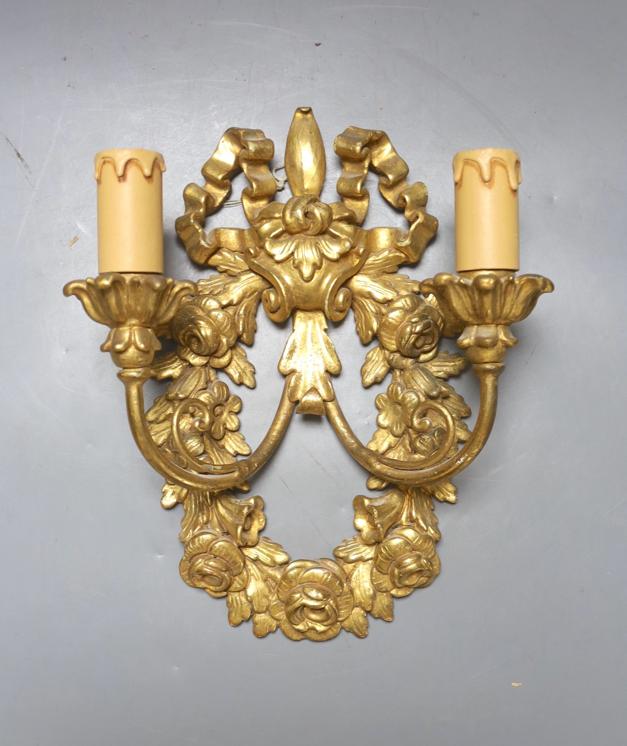 Two pairs of 18th century style Italian giltwood two branch wall lights and one other wall light, 62 cms high.